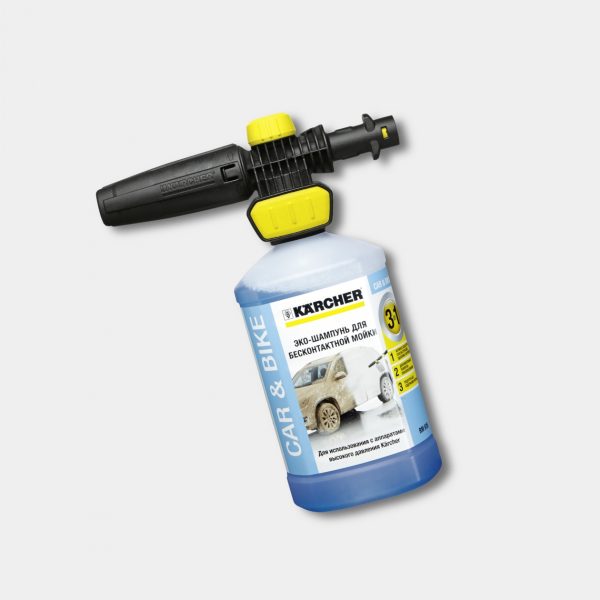A Foam nozzle Connect 'n' Clean FJ10 C Ultra Foam Cleaner 1L attachment connected to a container of car shampoo, isolated on a light gray background.
