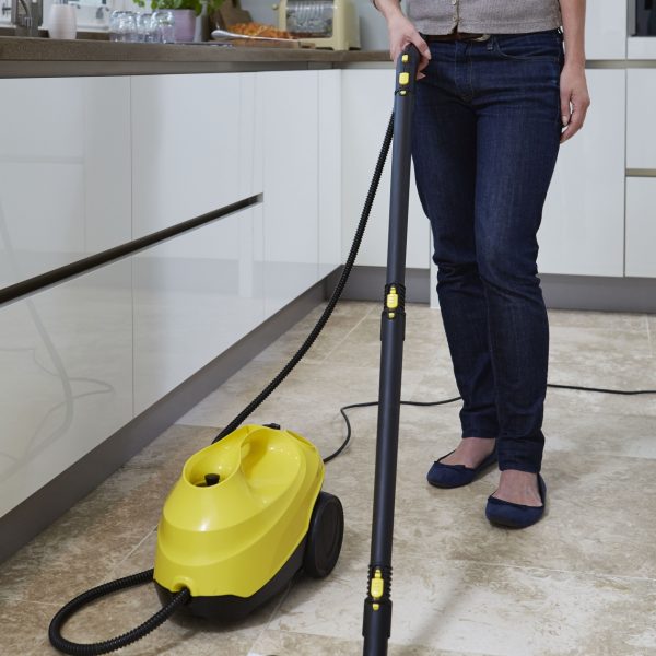 A person using 5 Wide Terry Cloths with a mop attachment on a kitchen tile floor.